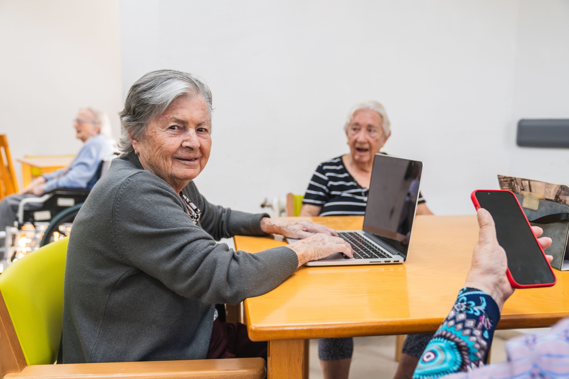 Seniors engaging with technology in nursing home